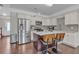 Modern kitchen with island, stainless steel appliances and eat-in bar seating at 4567 Hickory Forest Nw Dr, Acworth, GA 30102