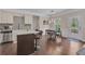 Well-lit kitchen with stainless appliances, granite counters, and a dining area with backyard access at 4567 Hickory Forest Nw Dr, Acworth, GA 30102