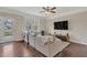 Living room with hardwood floors, large sectional couch, and a view to the outdoor patio at 4567 Hickory Forest Nw Dr, Acworth, GA 30102