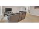 Living room with plush carpeting, leather sectional sofa, and TV at 4567 Hickory Forest Nw Dr, Acworth, GA 30102