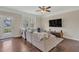 Spacious living room with wood floors, large sectional sofa, and access to the outdoors at 4567 Hickory Forest Nw Dr, Acworth, GA 30102