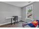 Home office with modern desk setup, hardwood floors, and natural light at 4567 Hickory Forest Nw Dr, Acworth, GA 30102