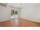 Bright dining room featuring hardwood floors and a sliding glass door leading to outdoor space at 525 Forest Pl, Roswell, GA 30076