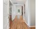 Inviting foyer with wood floors and a view of the living room and stone fireplace at 525 Forest Pl, Roswell, GA 30076