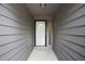 View of a home's front entryway with neutral siding and clean, modern design at 525 Forest Pl, Roswell, GA 30076