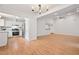 Open-concept living area with modern flooring, kitchen access, and ample natural light at 525 Forest Pl, Roswell, GA 30076