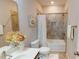 Bathroom featuring vanity with mirror, toilet, bathtub with shower, and tiled accent wall at 753 Topsail Ln, Alpharetta, GA 30005