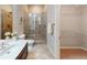 Bathroom with glass enclosed shower, vanity with sink and walk-in closet at 753 Topsail Ln, Alpharetta, GA 30005
