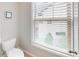 Bathroom with toilet, window with blinds, and tile floors at 753 Topsail Ln, Alpharetta, GA 30005