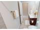 Bathroom featuring a vanity with mirror, toilet, towel rack with towel, and tiled floors at 753 Topsail Ln, Alpharetta, GA 30005