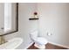 Bathroom with hardwood floors, toilet and single sink at 753 Topsail Ln, Alpharetta, GA 30005