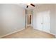 Cozy bedroom featuring neutral walls, wall-to-wall carpet, and a double door closet and adjoining bathroom at 753 Topsail Ln, Alpharetta, GA 30005