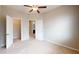 Bedroom showcasing neutral walls, carpet, and convenient access to both the walk-in closet and bathroom at 753 Topsail Ln, Alpharetta, GA 30005