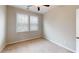 Bedroom with neutral carpet and walls with ceiling fan and window at 753 Topsail Ln, Alpharetta, GA 30005