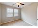 Bedroom featuring neutral walls, carpet, ceiling fan, and natural light from two windows with blinds at 753 Topsail Ln, Alpharetta, GA 30005