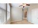 Bedroom featuring neutral walls, carpet, ceiling fan, and natural light from a window with blinds at 753 Topsail Ln, Alpharetta, GA 30005