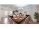 Elegant dining room features hardwood floors, stylish furnishings and décor, chandelier, and access to the kitchen at 753 Topsail Ln, Alpharetta, GA 30005