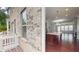 Exterior view of kitchen showing brick facade, outdoor deck and access to kitchen with island at 753 Topsail Ln, Alpharetta, GA 30005