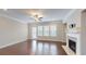 Spacious living area with hardwood floors, lots of natural light, and a modern fireplace at 753 Topsail Ln, Alpharetta, GA 30005