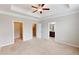 Bedroom features neutral walls, carpet, ensuite bathroom view, and walk-in closet at 753 Topsail Ln, Alpharetta, GA 30005