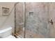 Walk-in shower with tile surround, glass door and built-in niche at 753 Topsail Ln, Alpharetta, GA 30005