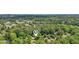Aerial view showcasing the home nestled in a lush, green neighborhood with trees at 1410 Lively Ridge Ne Rd, Atlanta, GA 30329