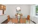 Elegant dining room with glass table, leather chairs and lots of natural light at 1410 Lively Ridge Ne Rd, Atlanta, GA 30329