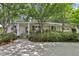 Charming ranch home with mature landscaping and a welcoming front entrance at 1410 Lively Ridge Ne Rd, Atlanta, GA 30329