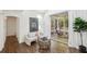 Bright and airy living room with hardwood floors and access to a screened porch at 1410 Lively Ridge Ne Rd, Atlanta, GA 30329