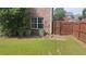 The back of the property features green grass and partial privacy fence at 1481 Park Knoll Trl, Lawrenceville, GA 30043