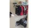 Functional closet with wire shelving, clothing rack, and plenty of storage for luggage at 1481 Park Knoll Trl, Lawrenceville, GA 30043
