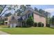 Charming two-story brick home features a two-car garage and a well-manicured lawn at 1481 Park Knoll Trl, Lawrenceville, GA 30043