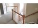 Upstairs hallway with hardwood floors and railing, leading to multiple rooms at 1481 Park Knoll Trl, Lawrenceville, GA 30043