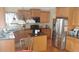 Well-lit kitchen with stainless steel appliances, granite countertops, and ample cabinet space at 1481 Park Knoll Trl, Lawrenceville, GA 30043
