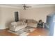 Cozy living room features hardwood floors, neutral paint, and a comfortable sectional sofa at 1481 Park Knoll Trl, Lawrenceville, GA 30043