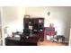 The office has a large desk, bookcase and storage, perfect for working from home productively at 1481 Park Knoll Trl, Lawrenceville, GA 30043