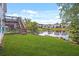 The backyard features a deck, staircase, waterfront access, and luscious green grass at 1544 Overview Cir, Lawrenceville, GA 30044