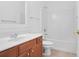 The bathroom offers a shower and tub combo, a single vanity, and neutral tile flooring at 1544 Overview Cir, Lawrenceville, GA 30044