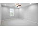 This finished bedroom features neutral carpeting, a ceiling fan, recessed lights, and a bright window at 1544 Overview Cir, Lawrenceville, GA 30044