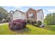This charming home features a stone and siding facade with manicured landscaping at 1544 Overview Cir, Lawrenceville, GA 30044