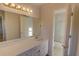 Bathroom with vanity and access to toilet and shower with glass doors at 3407 Larch Pine Dr, Duluth, GA 30096