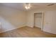 Bedroom with ceiling fan, open closet, and light wood floors at 3407 Larch Pine Dr, Duluth, GA 30096