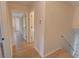 Hallway with wooden floors and access to multiple rooms at 3407 Larch Pine Dr, Duluth, GA 30096