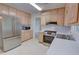 Bright kitchen with modern stainless-steel appliances, white counters and access to dining area at 3407 Larch Pine Dr, Duluth, GA 30096