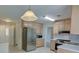 Charming kitchen with stainless steel appliances, bright cabinets and breakfast area at 3407 Larch Pine Dr, Duluth, GA 30096