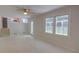 Open living room with a view to the backyard featuring stairs and a connection to the kitchen at 3407 Larch Pine Dr, Duluth, GA 30096