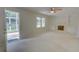 Inviting living room featuring a fireplace, built-in shelves, and access to a sunroom at 3407 Larch Pine Dr, Duluth, GA 30096