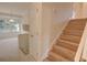Staircase with wood stairs leading to the second floor and tile flooring at 3407 Larch Pine Dr, Duluth, GA 30096