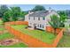 Aerial view of the home showcasing its expansive, fenced-in backyard and lush surroundings at 408 Sam Cobb Ct, Woodstock, GA 30188