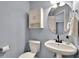 Bathroom with vanity sink, commode, and decor at 408 Sam Cobb Ct, Woodstock, GA 30188